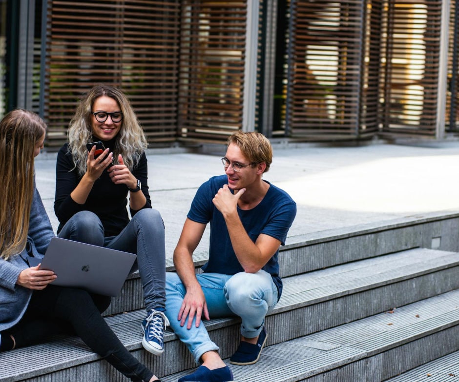 people sitting on street steps