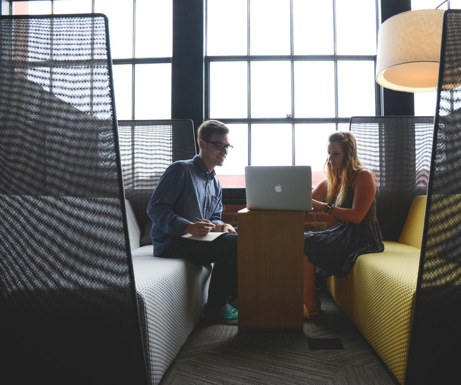 two people using laptop