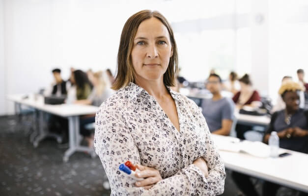 Professional standing with arms crossed