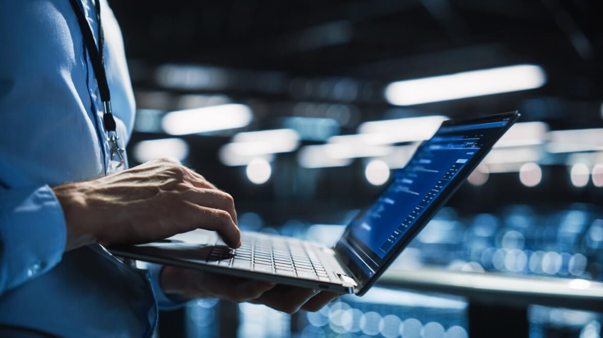 person looking code in laptop