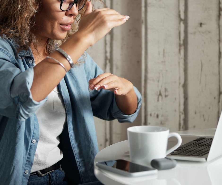 Person on a video call with coffee