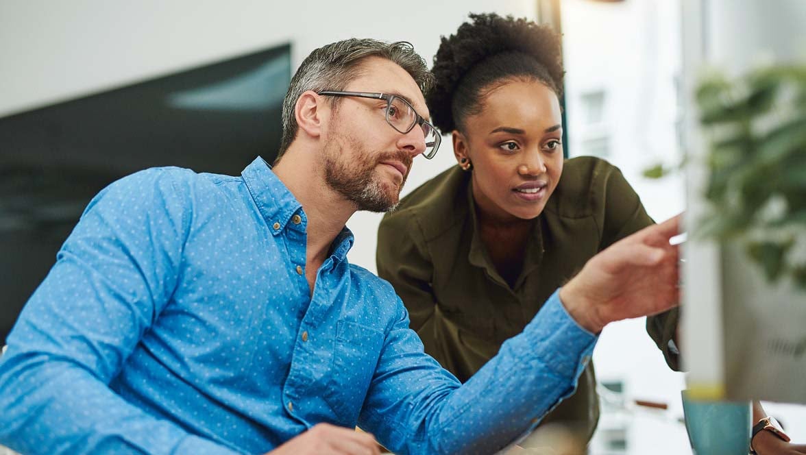 Two people looking at product features