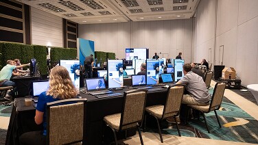 conference area where professionals are getting hands-on interaction with NetApp