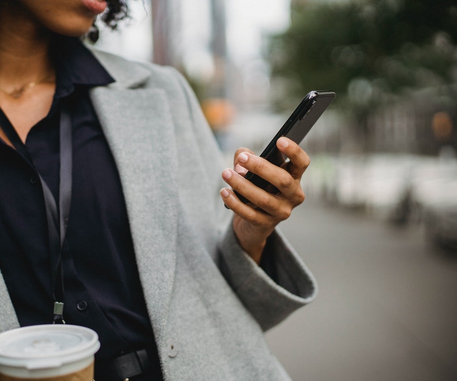 a person holding a smart phone