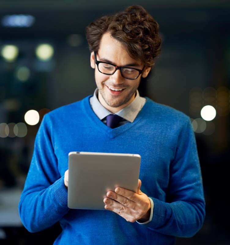 Person smiling at tablet