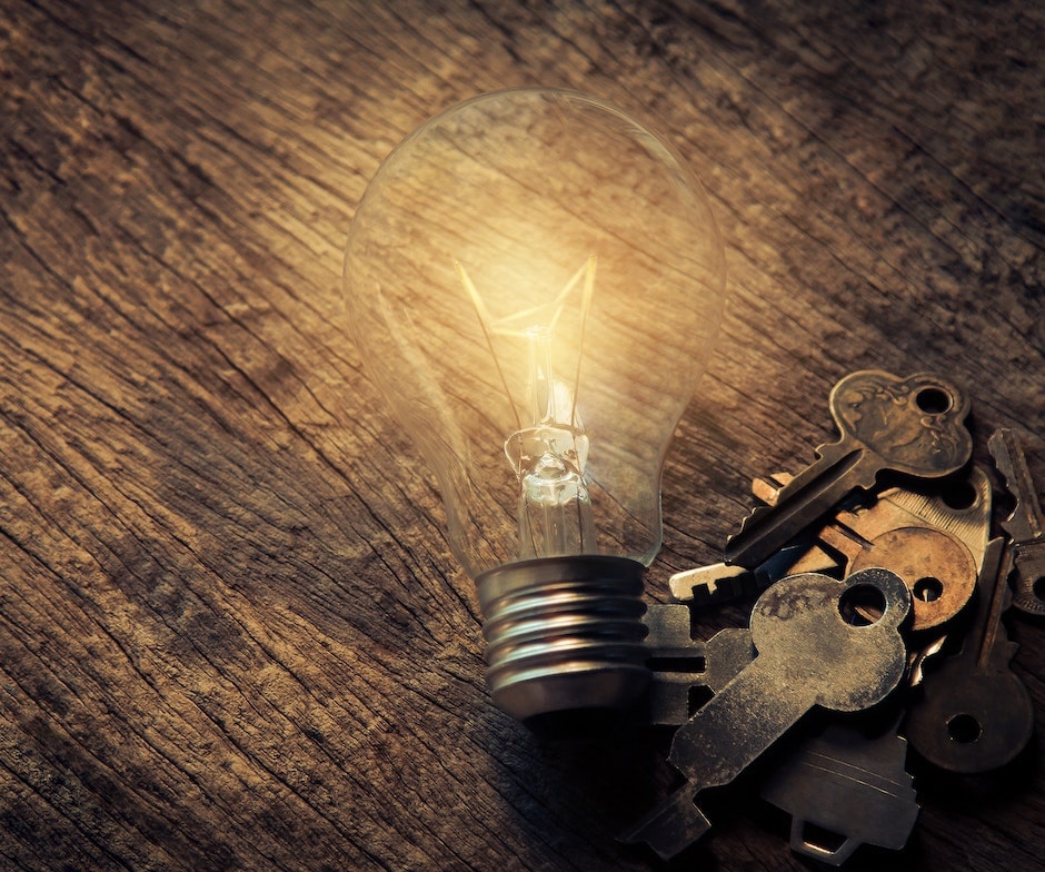light bulb and bunch of keys on table