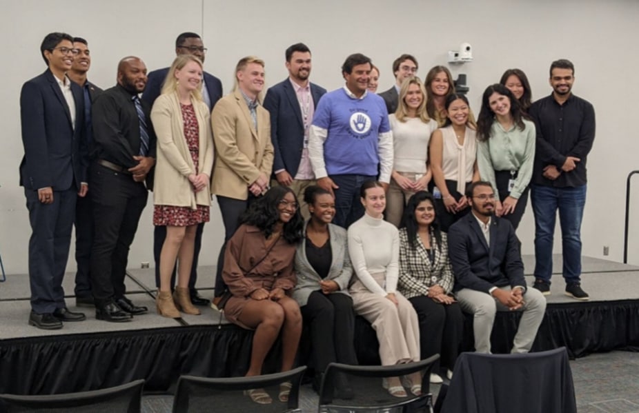 People posing in a photo and smiling