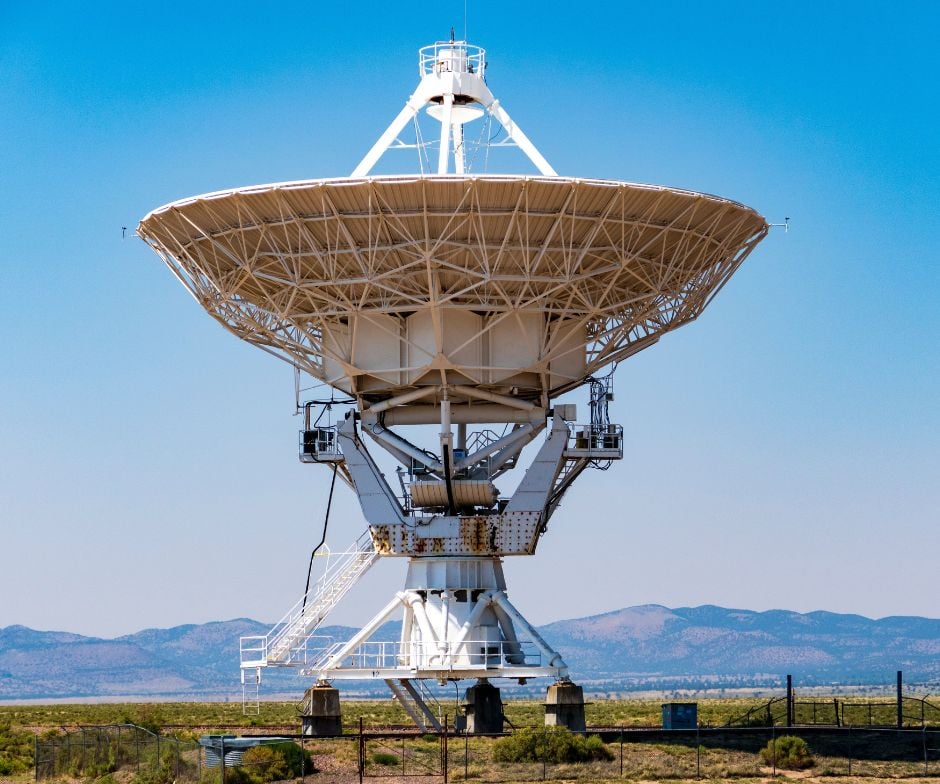 big satellite dish pointing out to sky