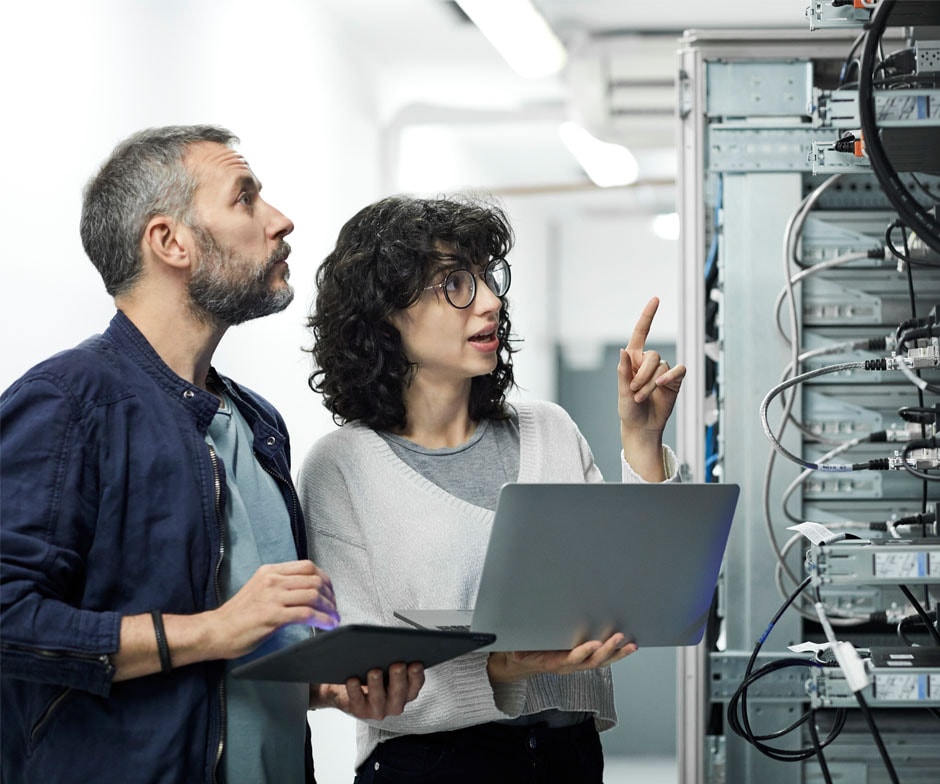 two people working in datacenter