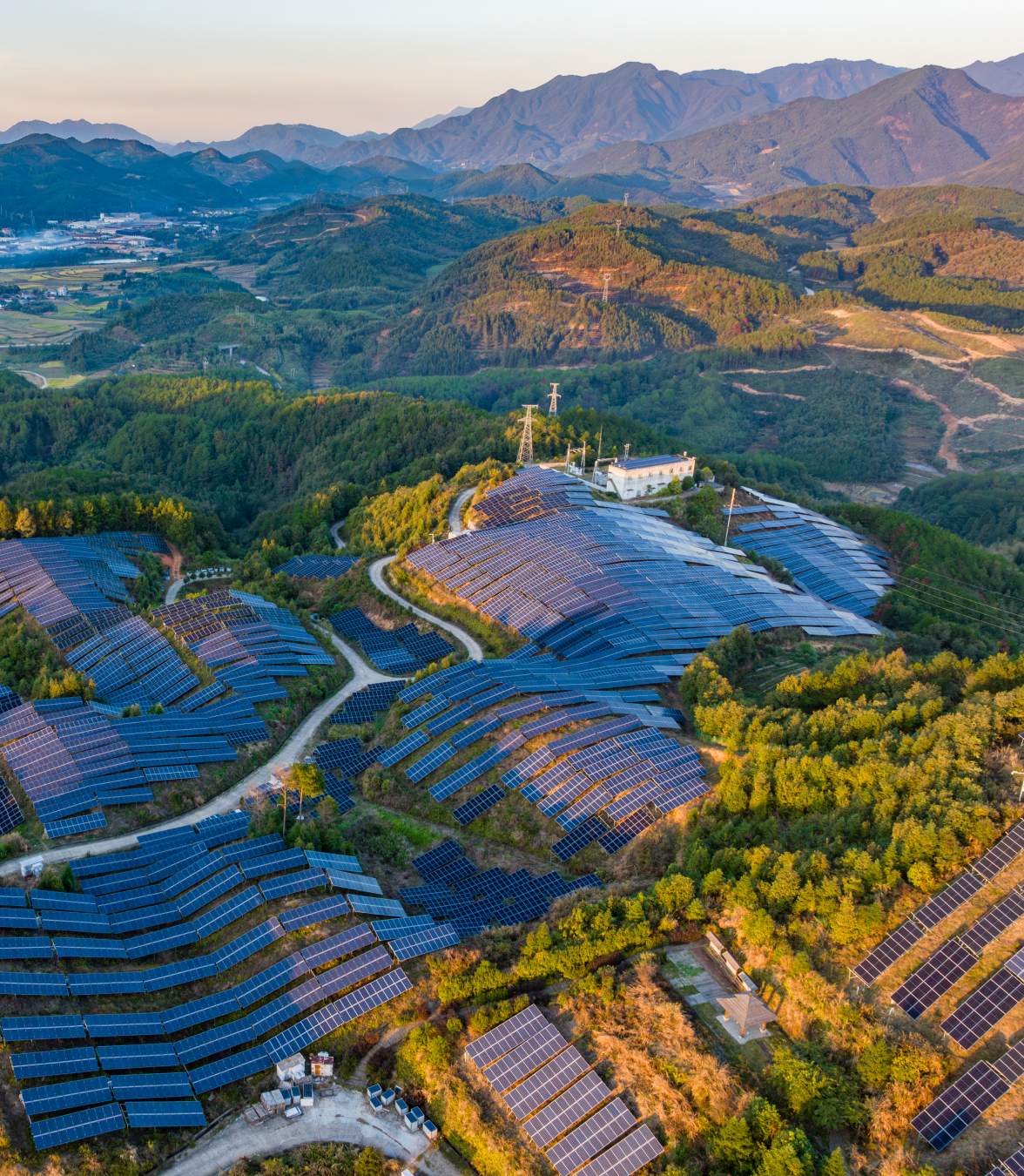 aerial view of solar panels on top of mountain
