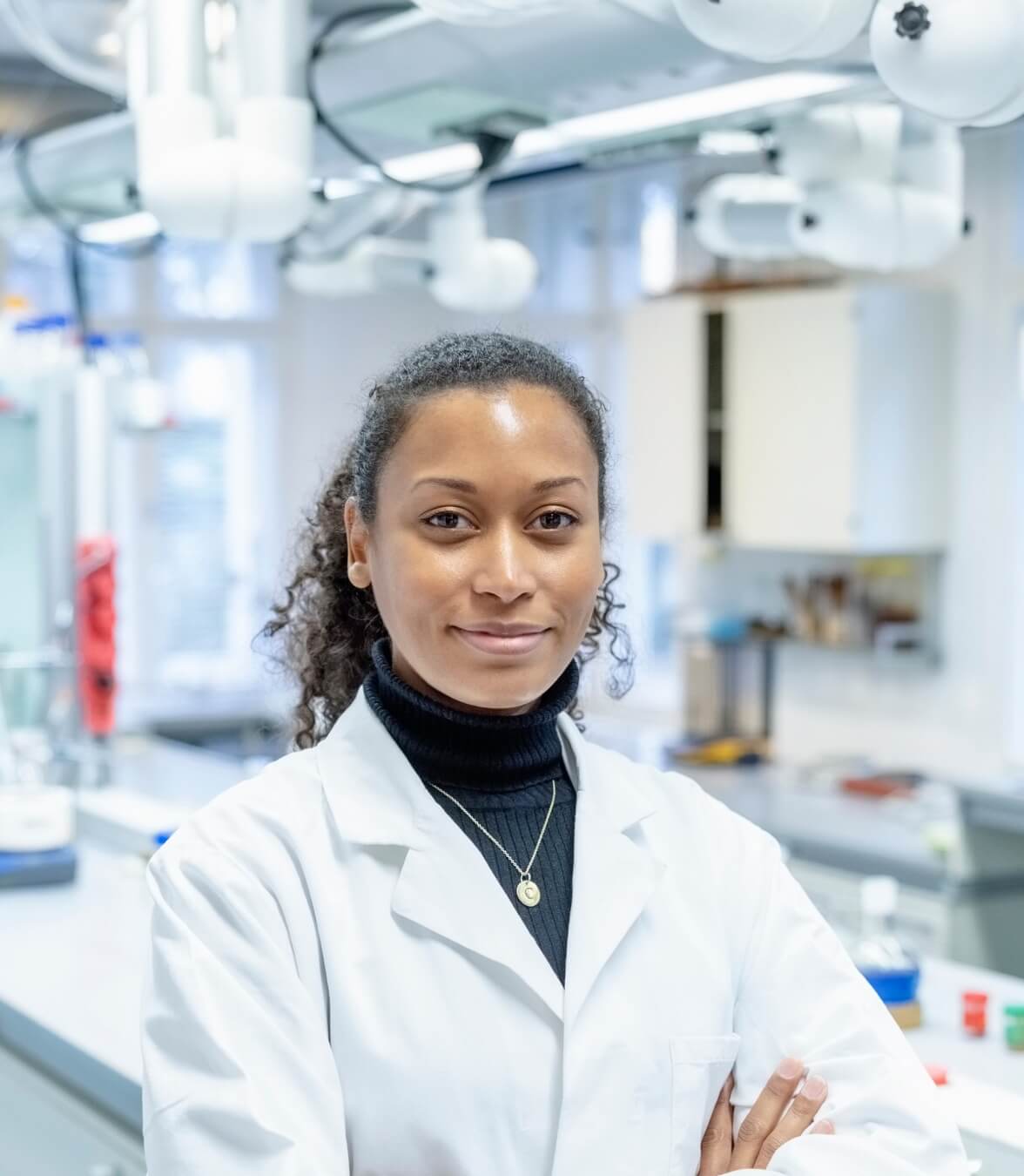 professional in white coat looking at the camera