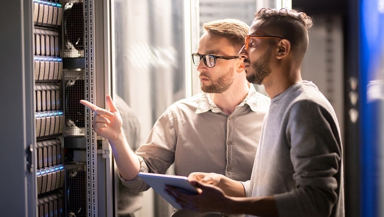 Two men checking servers
