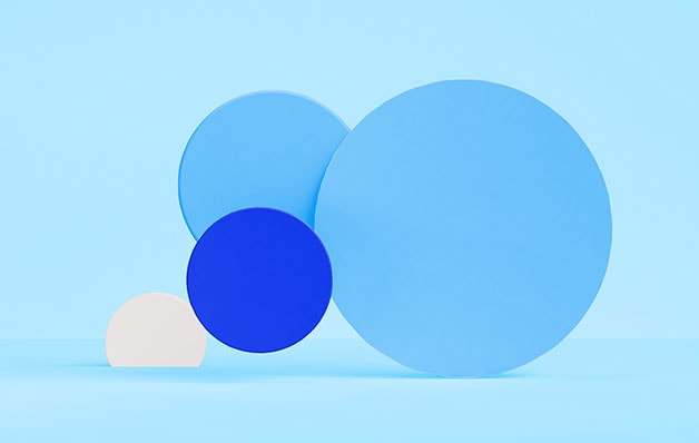 blue, white and dark blue circles of varying sizes in front of light blue background