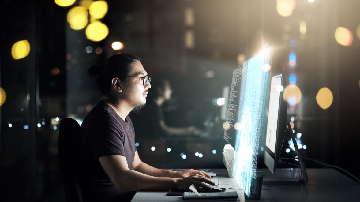 A Person looking into the monitor and working