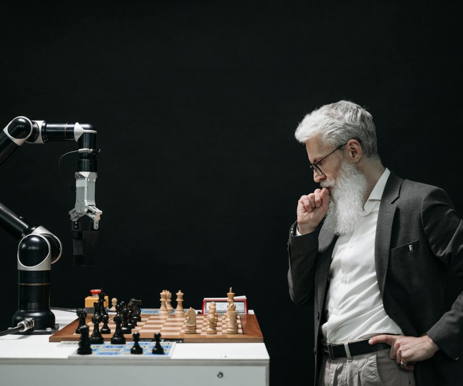 Man playing chess with a robot