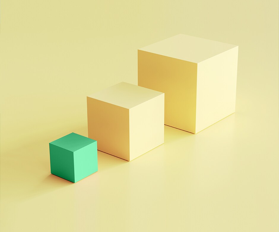 three cubes on a yellow background