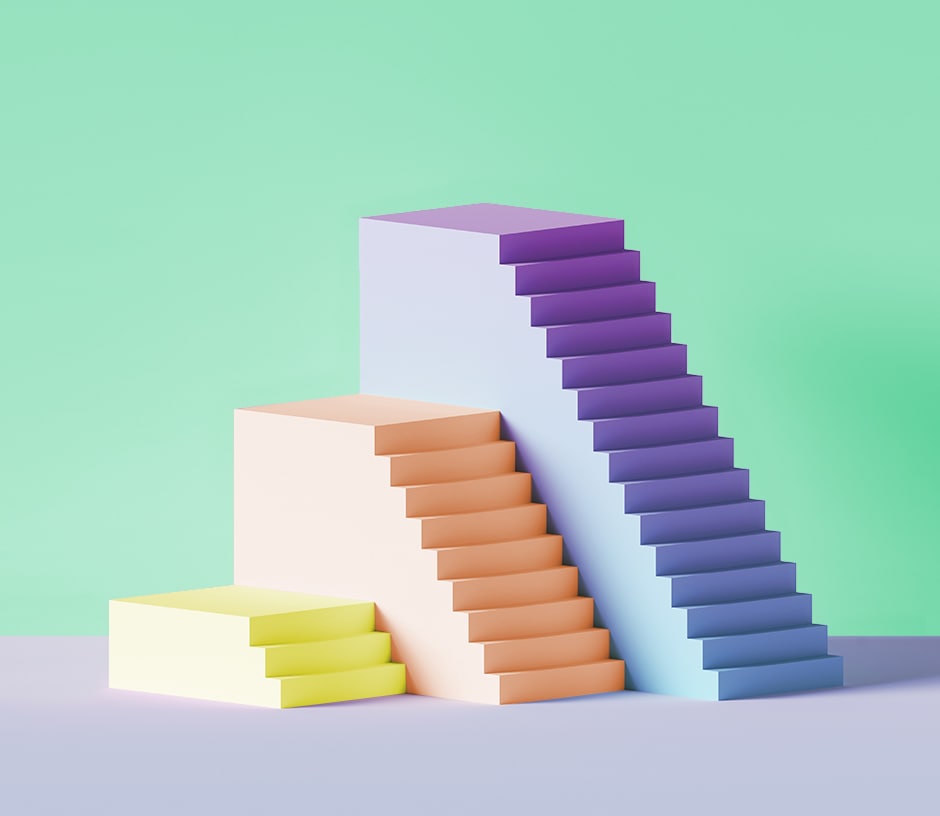 stair-shaped objects of different heights and colors in front of green background