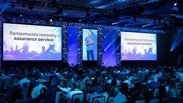 Keynote presentation being given from conference stage