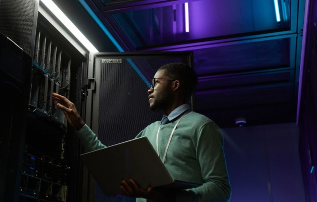 Man looking at servers