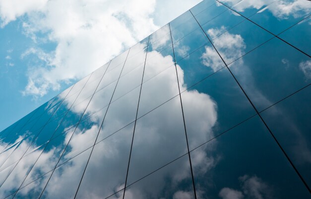 clouds reflecting on building windows