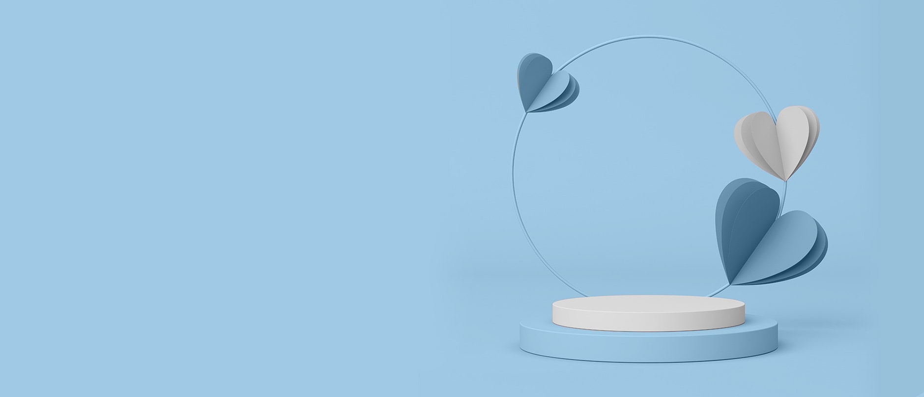 two circles with floating blue and white hearts above it on a blue background