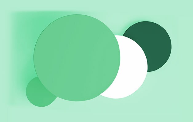 green, white and dark green circles of varying sizes in front of light green background