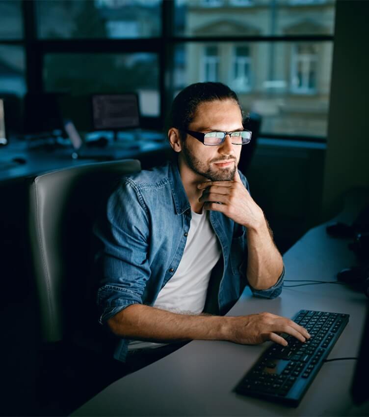 Person looking at monitor and analyzing