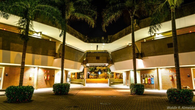 view of entrance of the building at night with lights