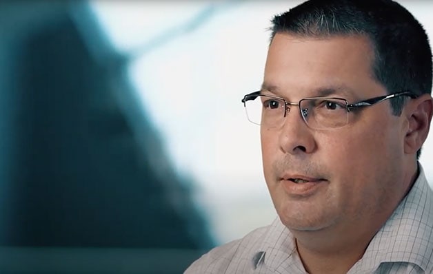 headshot of man with glasses