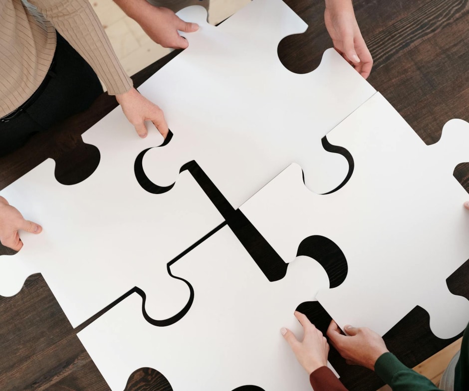 people putting together a puzzle