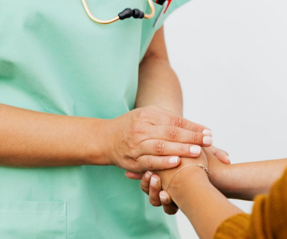 doctor holding patient hands