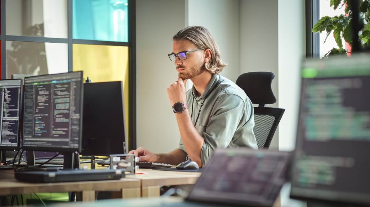 person working in workplace and thinking