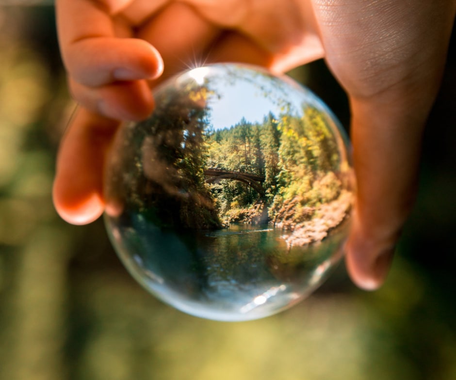 Hand holding a glass ball