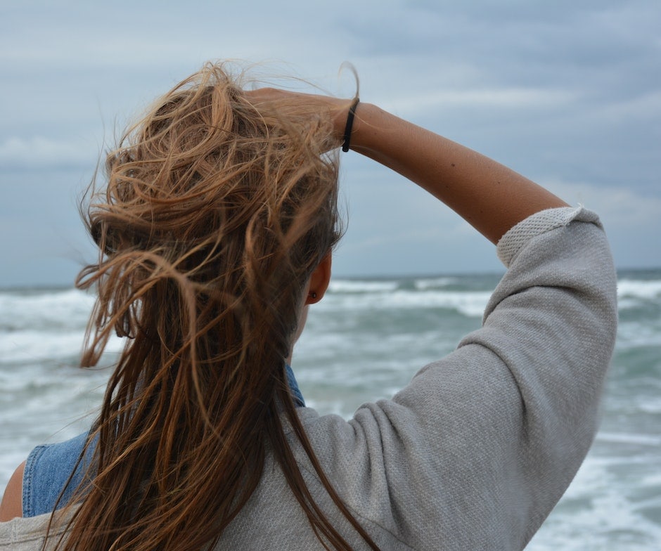 Girl standing infront of water
