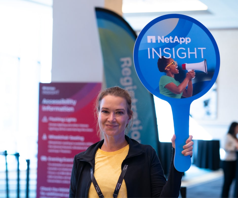 person holding NetApp Insight post