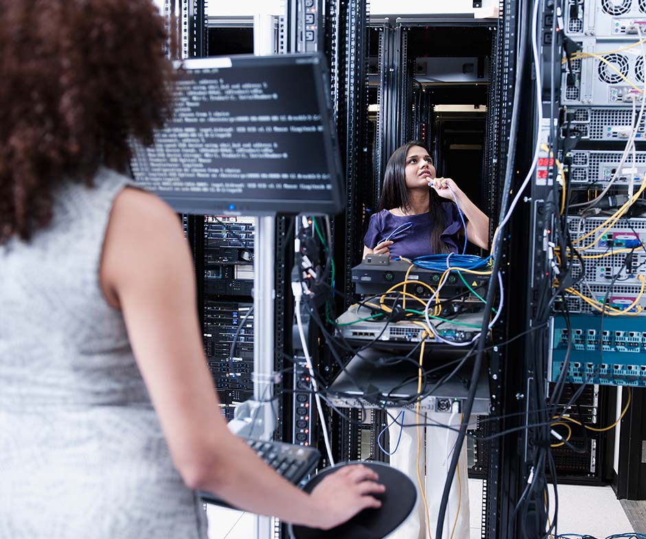 two people working in datacenter