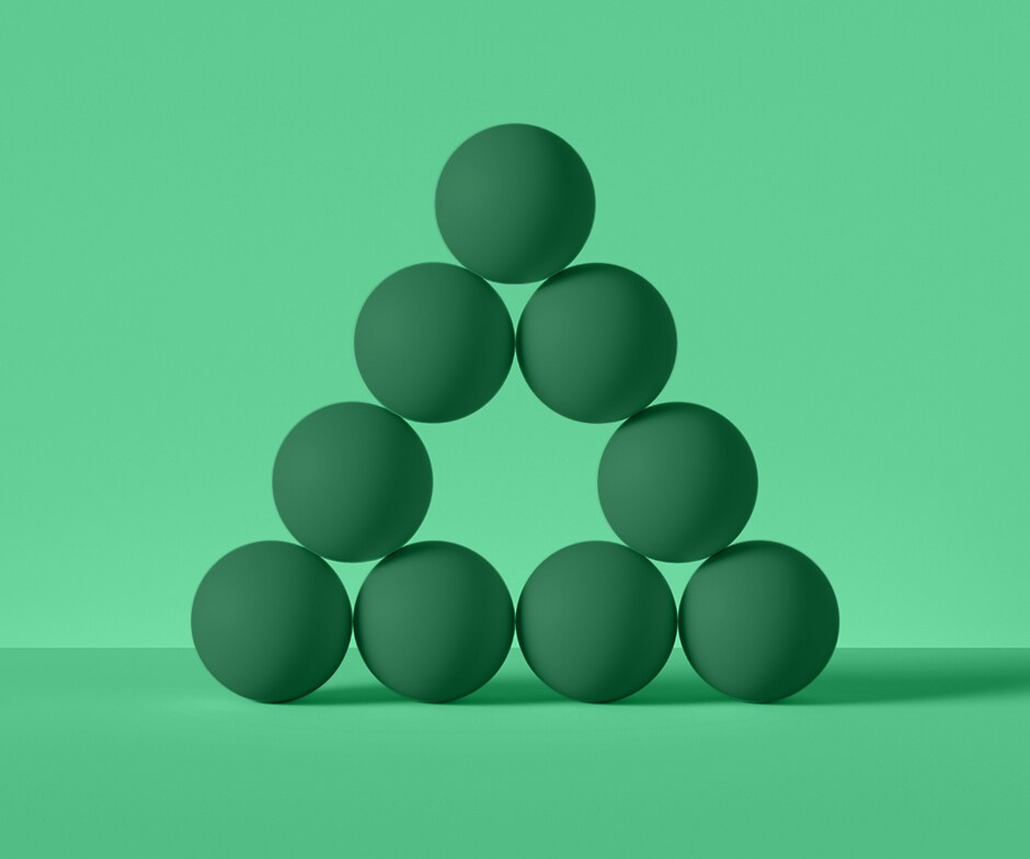 green background with 9 green spheres arranged in a pyramid, with the center piece missing