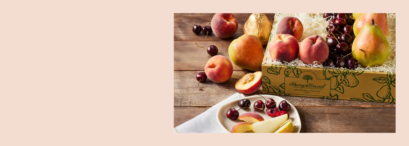 Desktop 1400x500 Summer Harvest Sale hero background with peaches, cherries, and pears for Harry & David.