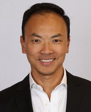 Professor James Chong, smiling at the camera while wearing a suit.