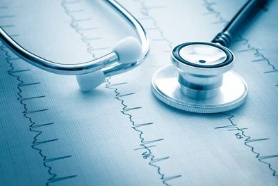 Stethoscope placed on top of printed medical chart