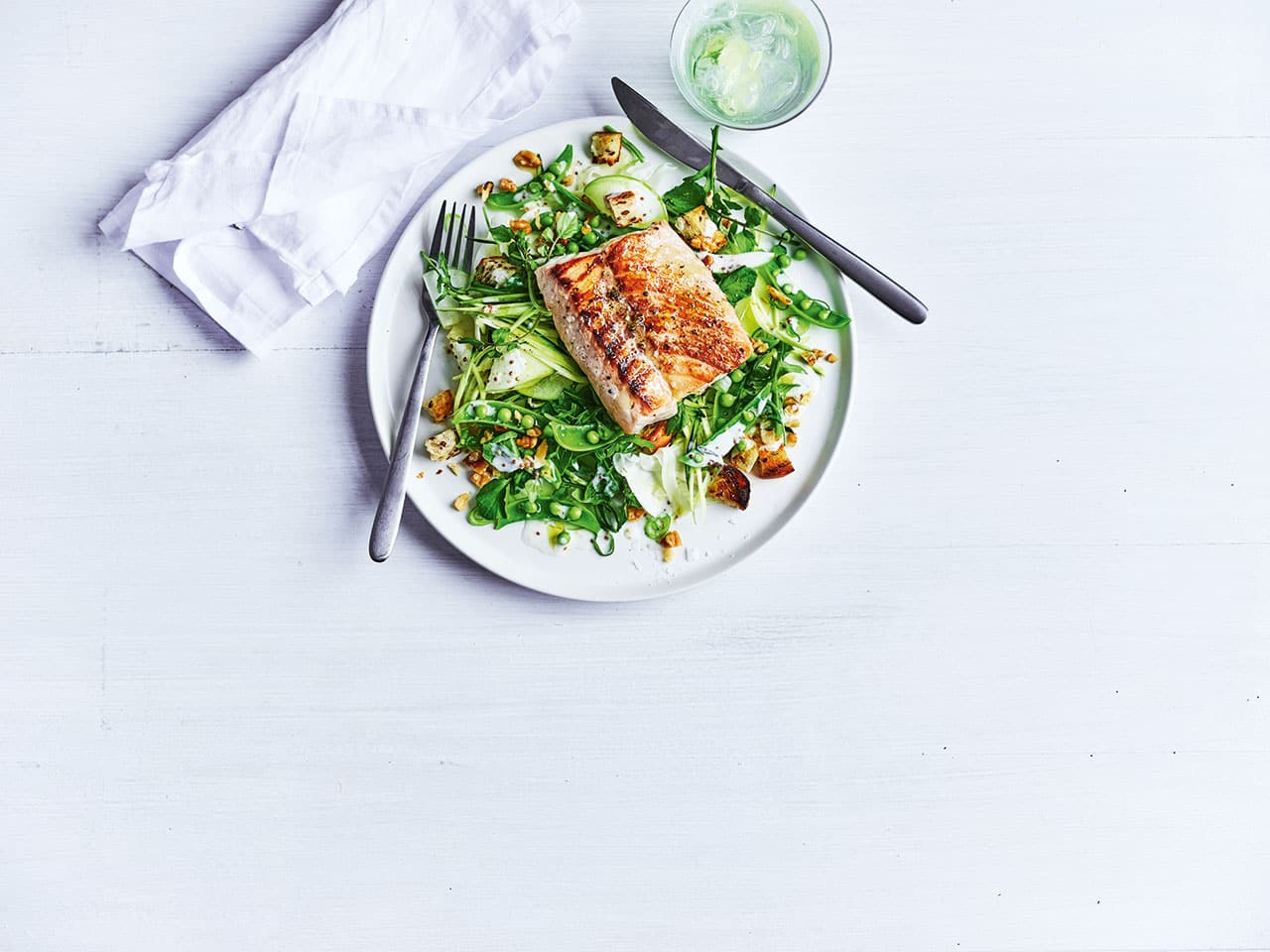 a plate of Pan fried fish with apple salad