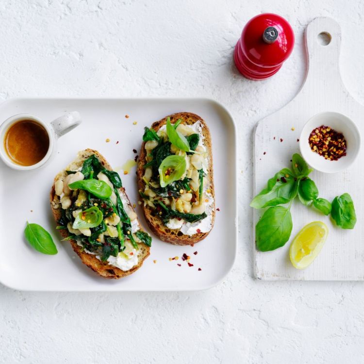 Finished bruschetta sprinkled with basil and chilli flakes