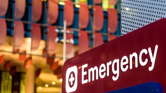 An "Emergency" Sign in front of a hospital in the early evening