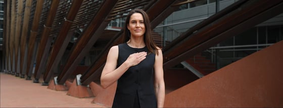 Dr Cassandra Smith with hand on heart