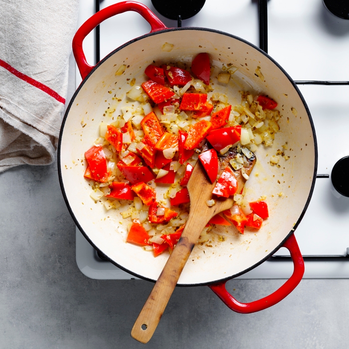 onion, garlic, capsicum and oregano cooking in a pan