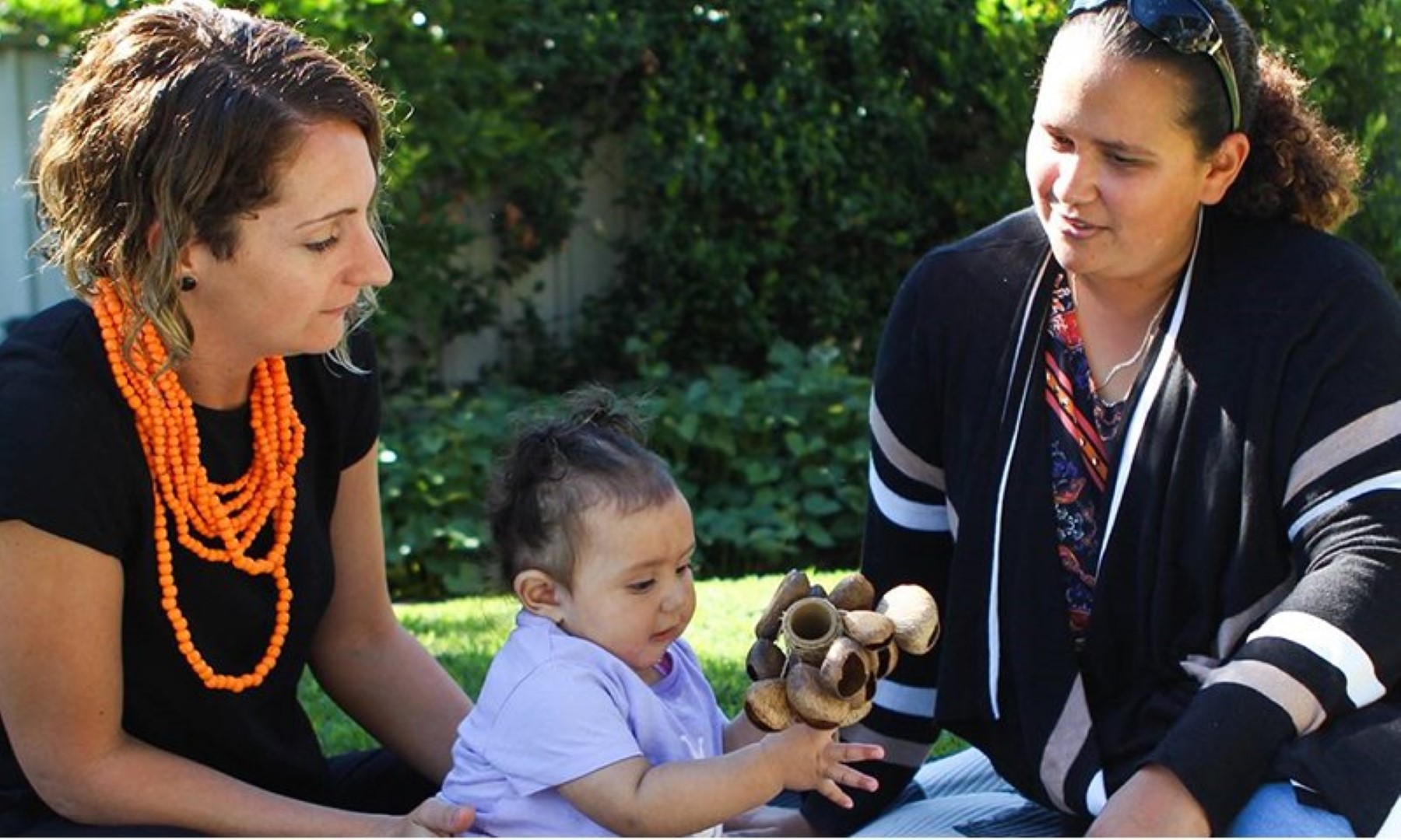 michelle-bovill with other woman and a child having conversation