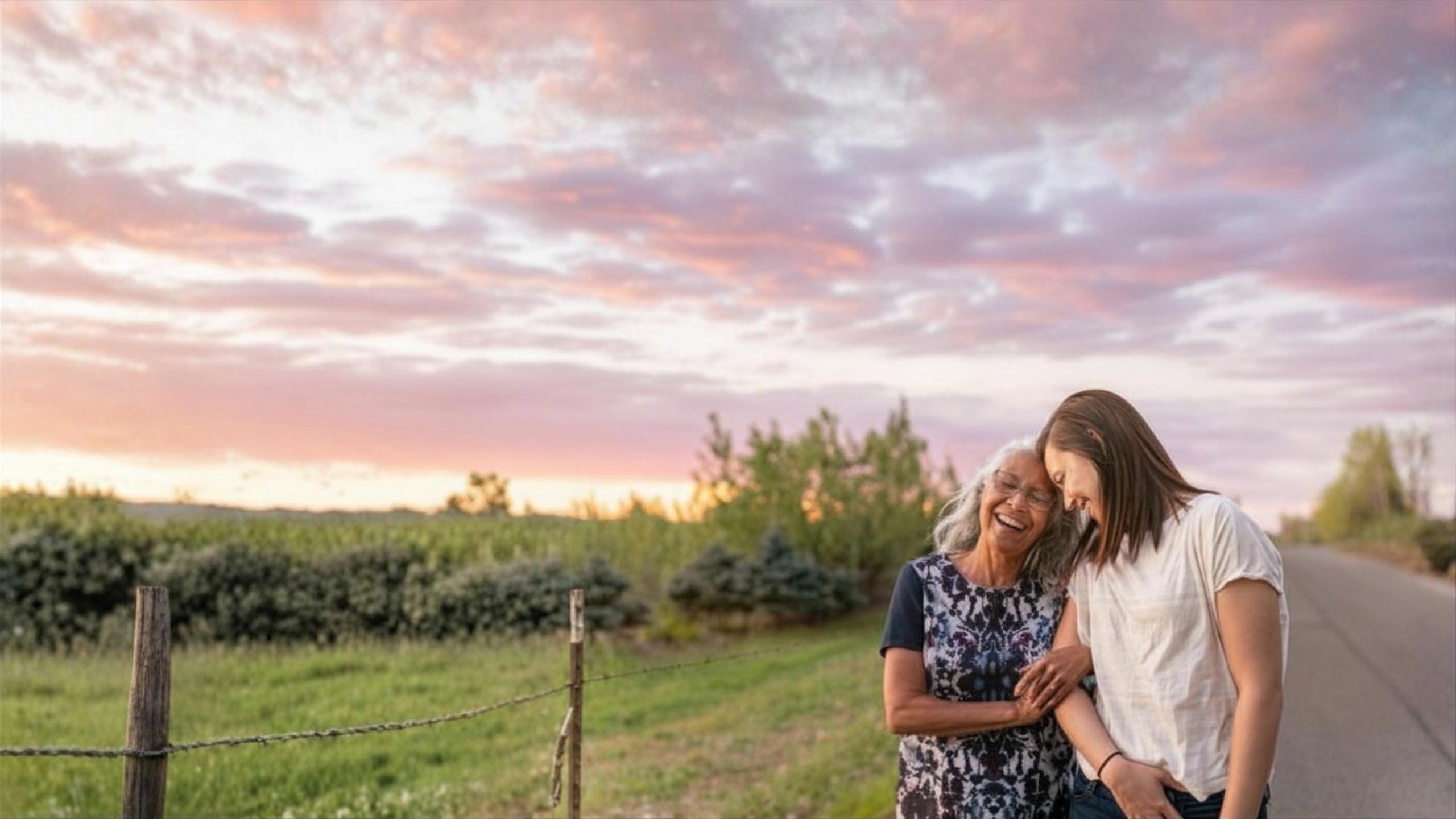 Woman and her older mother arms linked