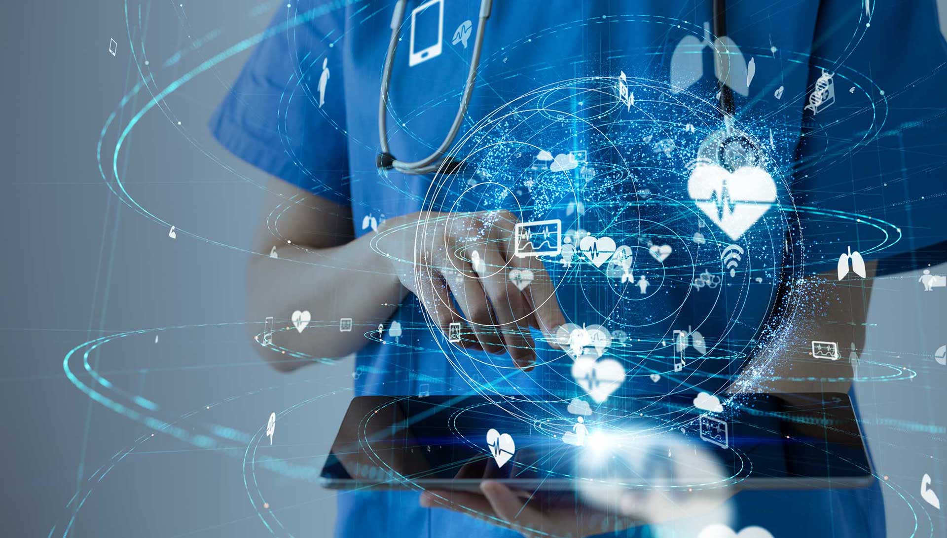 Medical professional holding a tablet, with imaginary heart research icons swirling around her hand