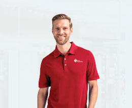 Smiling Heart Foundation fundraiser, wearing red polo shirt 