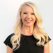 Tanya Hall CEO Hearts4Heart smiling wearing black top.